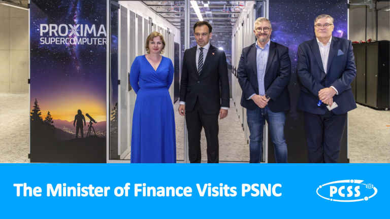 The image shows the Minister of Finance visiting the Poznań Supercomputing and Networking Center (PSNC). Urszula Grygier – the Deputy Director of PSNC, Andrzej Domański – the Polish Minister of Finances, Robert Pękal – the Director of PSNC and Artur Binczewski – the Director of Network Technologies Division at PSNC are standing next to the PROXIMA SUPERCOMPUTER. The image's caption is "The Minister of Finance Visits PSNC".